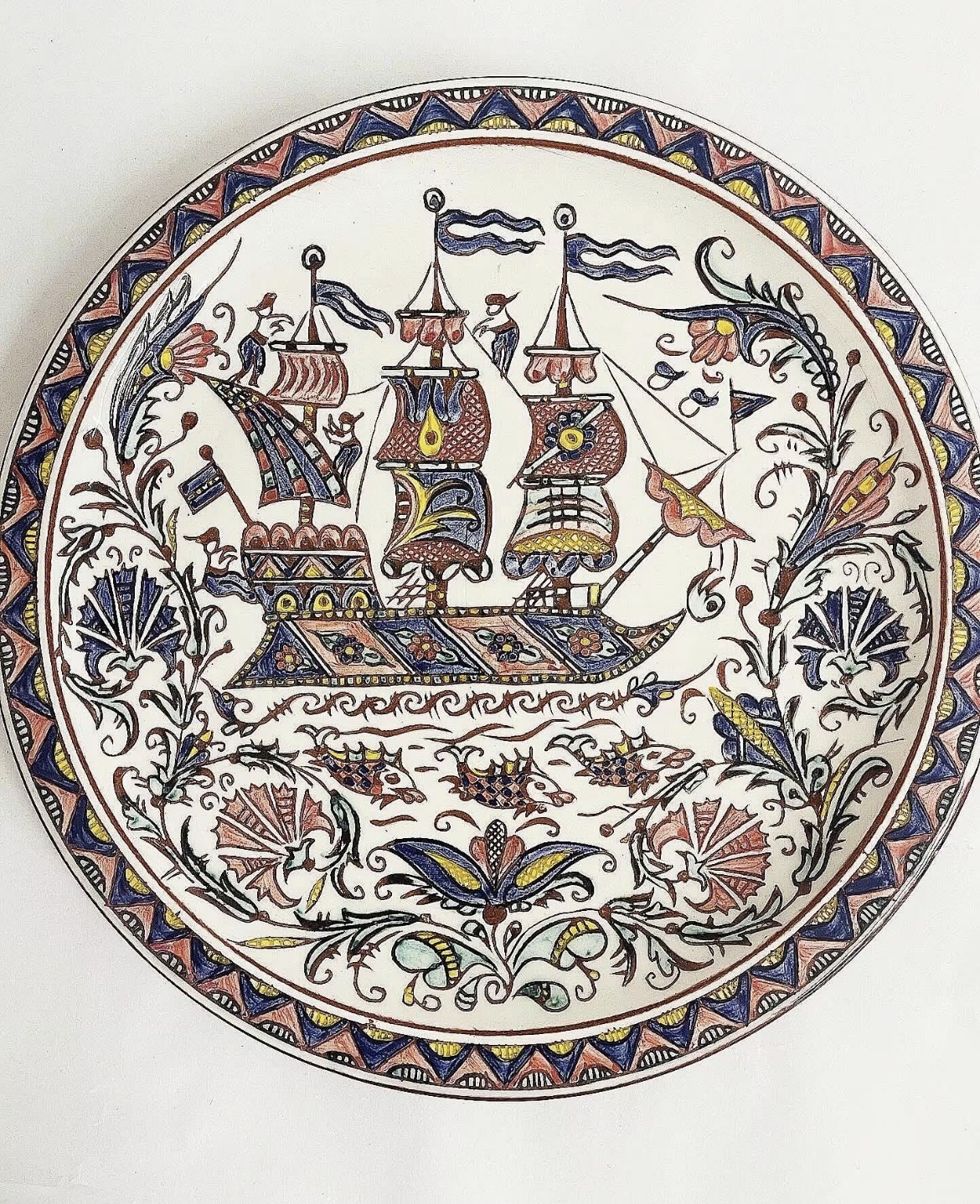 Antique plate with a boat