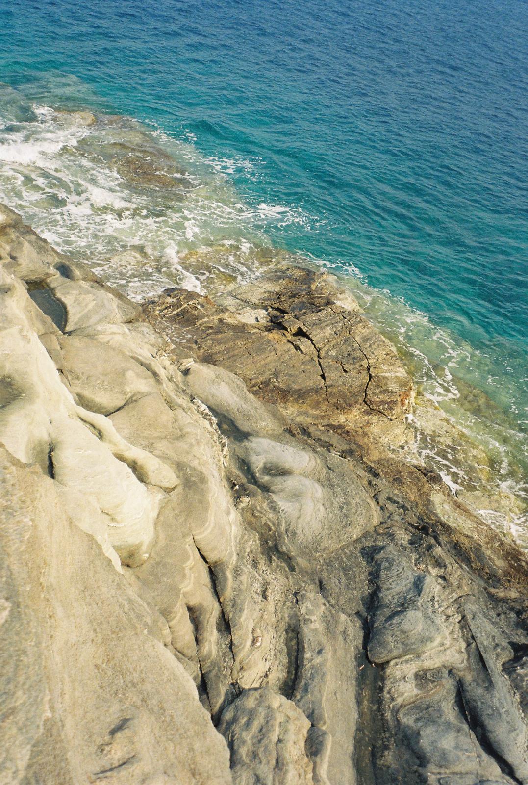 Coastal rock and turquoise water