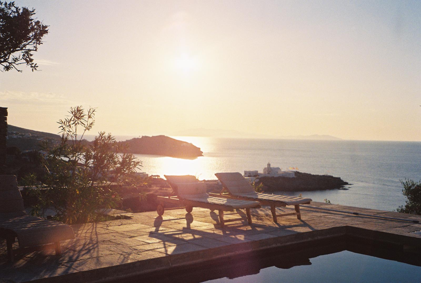 Pool loungers at dusk